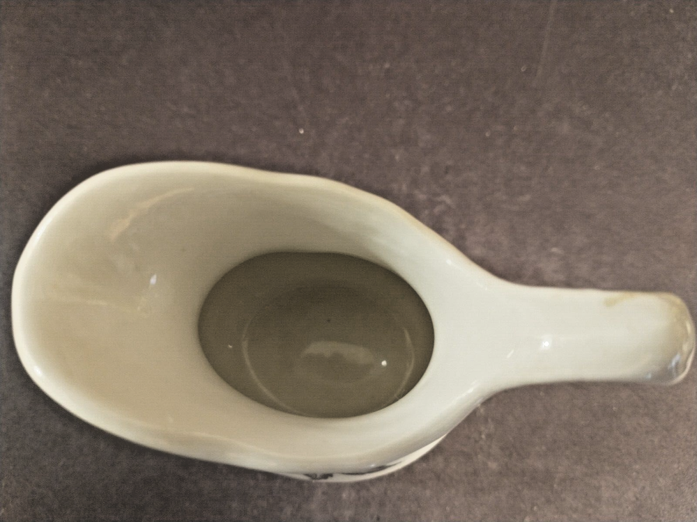McNicol small creamer with glaze damage on handle