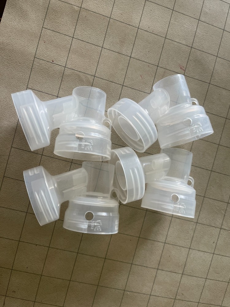 (4) New Medela connectors (2 pair)