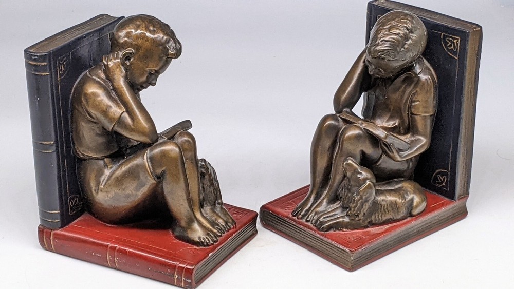 Boy reading with Dog Bookends heavy !
