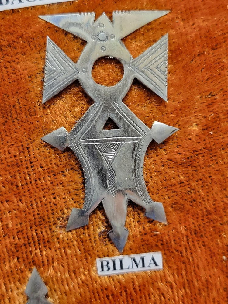 Collection of Hand-tooled Tin Badges