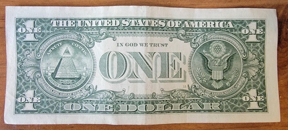 One dollar bill turn digit gas pump note