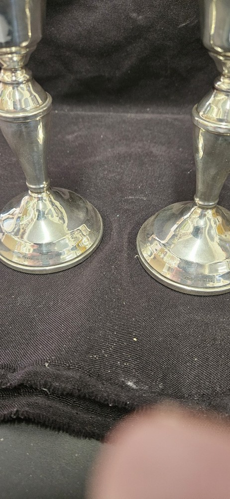 A Pair Of Antique Silver Candlesticks