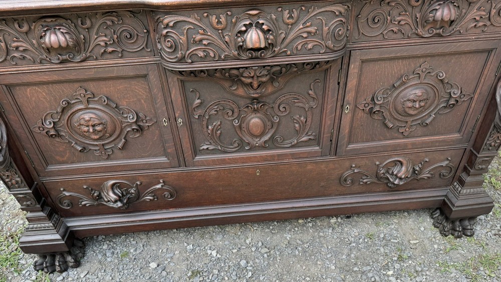 A. J. JOHNSON CARVED FIGURAL OAK SIDEBOARD