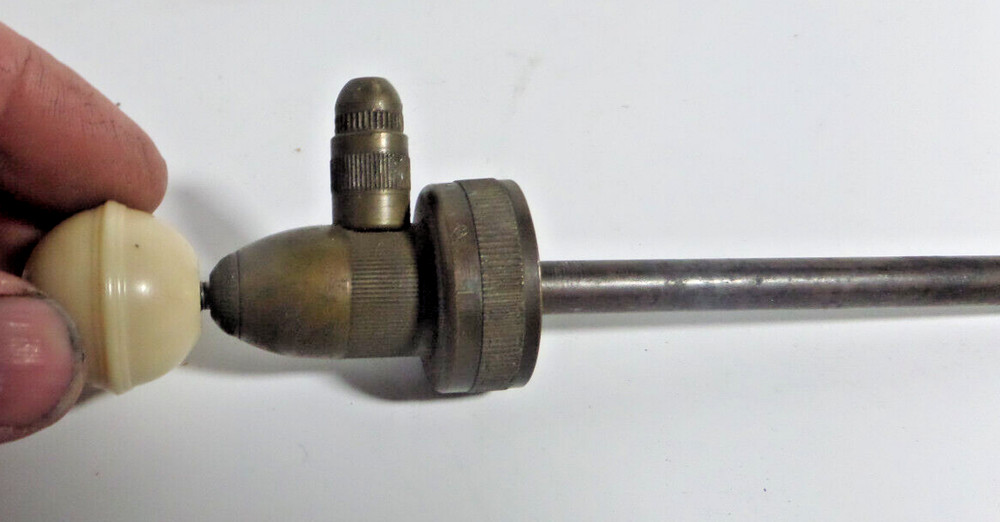 brass pump nozzle for a bottle? vintage