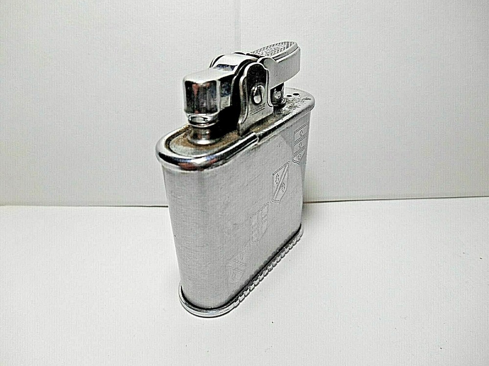 Vintage Ronson WHIRLWIND CHROME CIGARETTE LIGHTER. ETCHED 14TH CENTURY SHIELDS