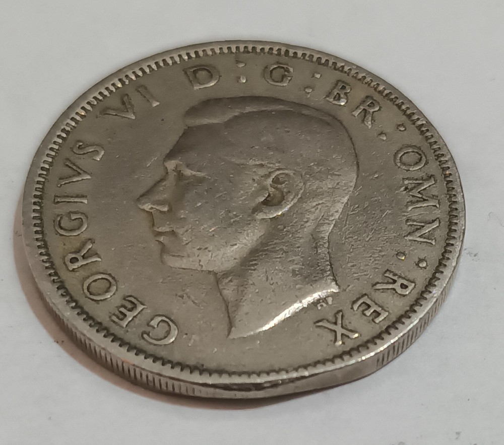 George V and George VI coins with error