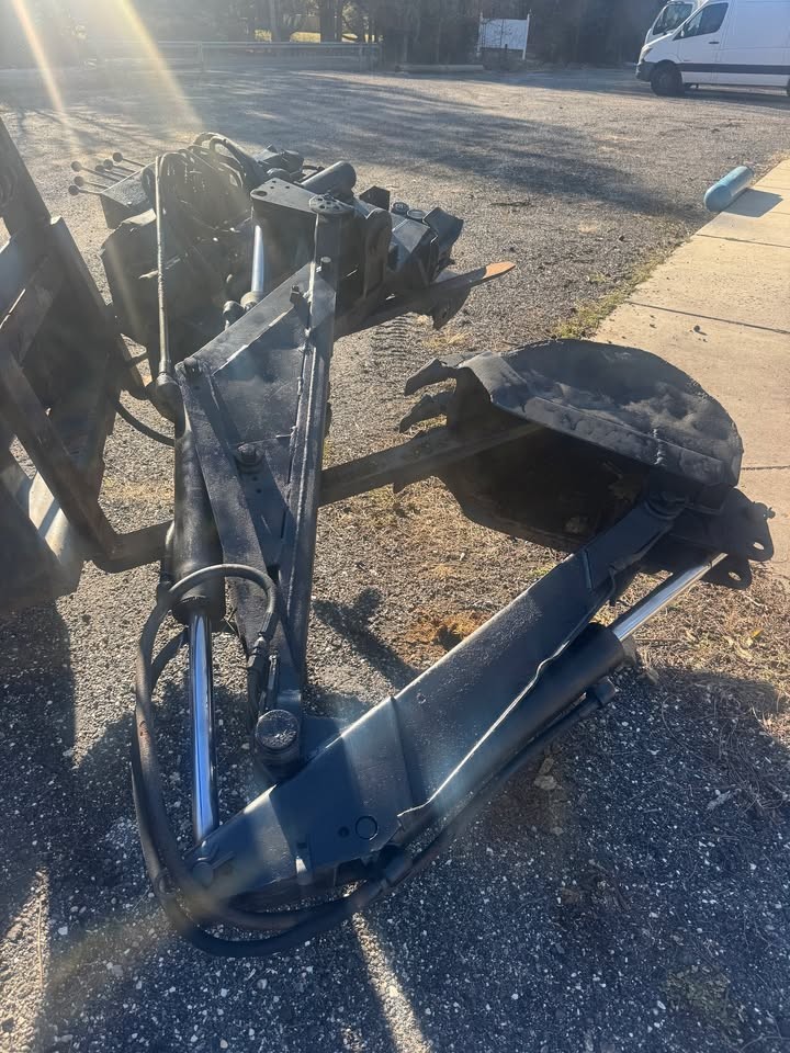 Heavy-duty white backhoe-used good shape