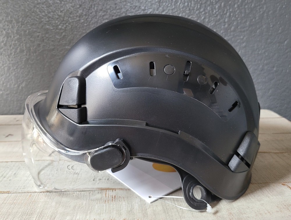 Arborist climber helmet with eye protection visor.