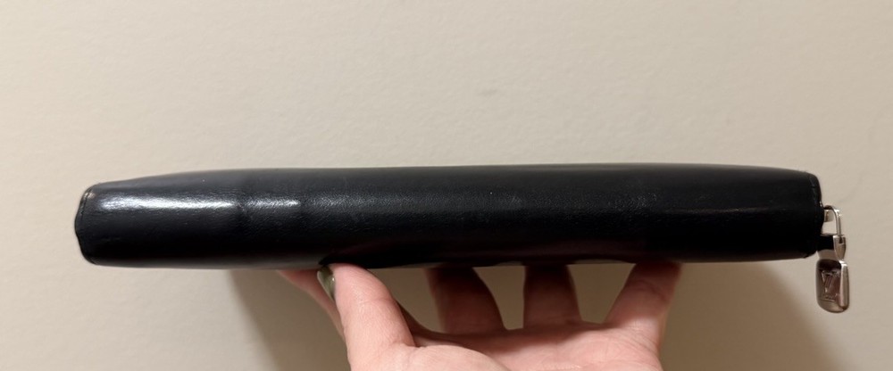 Authentic Louis Vuitton - Black Leather Zippy Wallet.