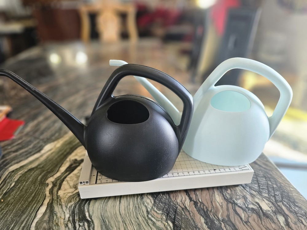 Watering can in blue or black