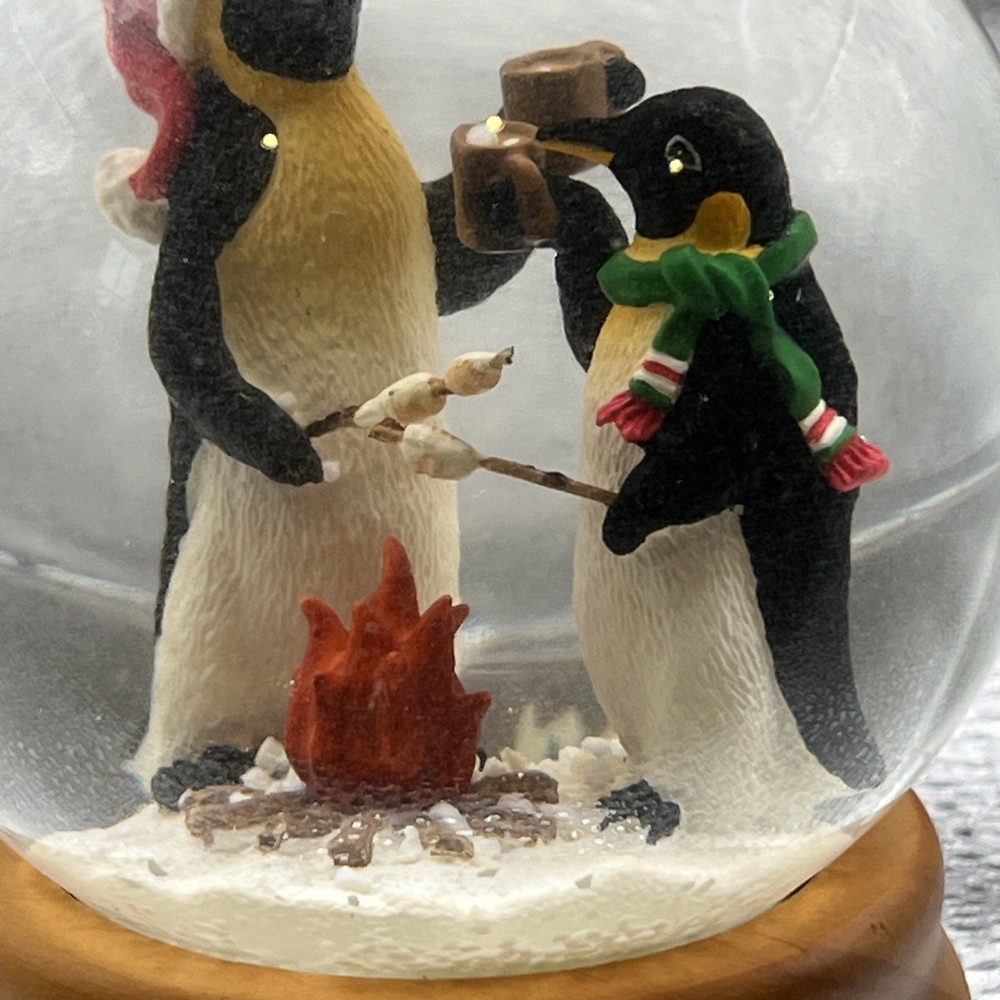 Eddie Bauer Penguin Snow globe 2002 Open Fire Roasting Marshmallows