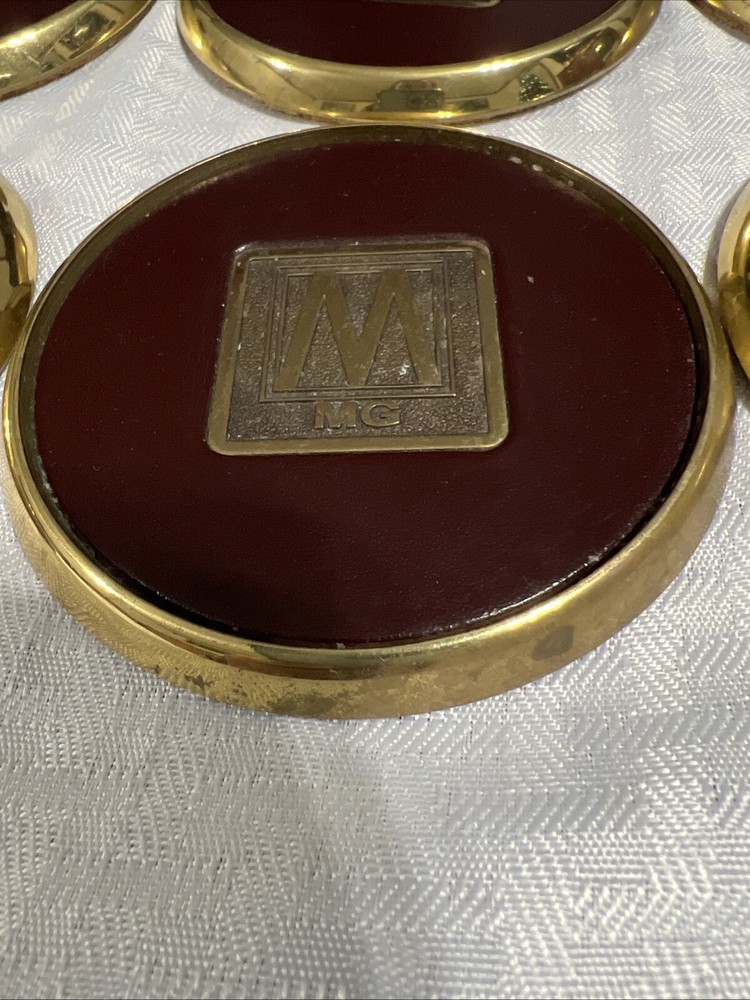 8 Vintage Solid BRASS and Brown LEATHER M MG COASTERS