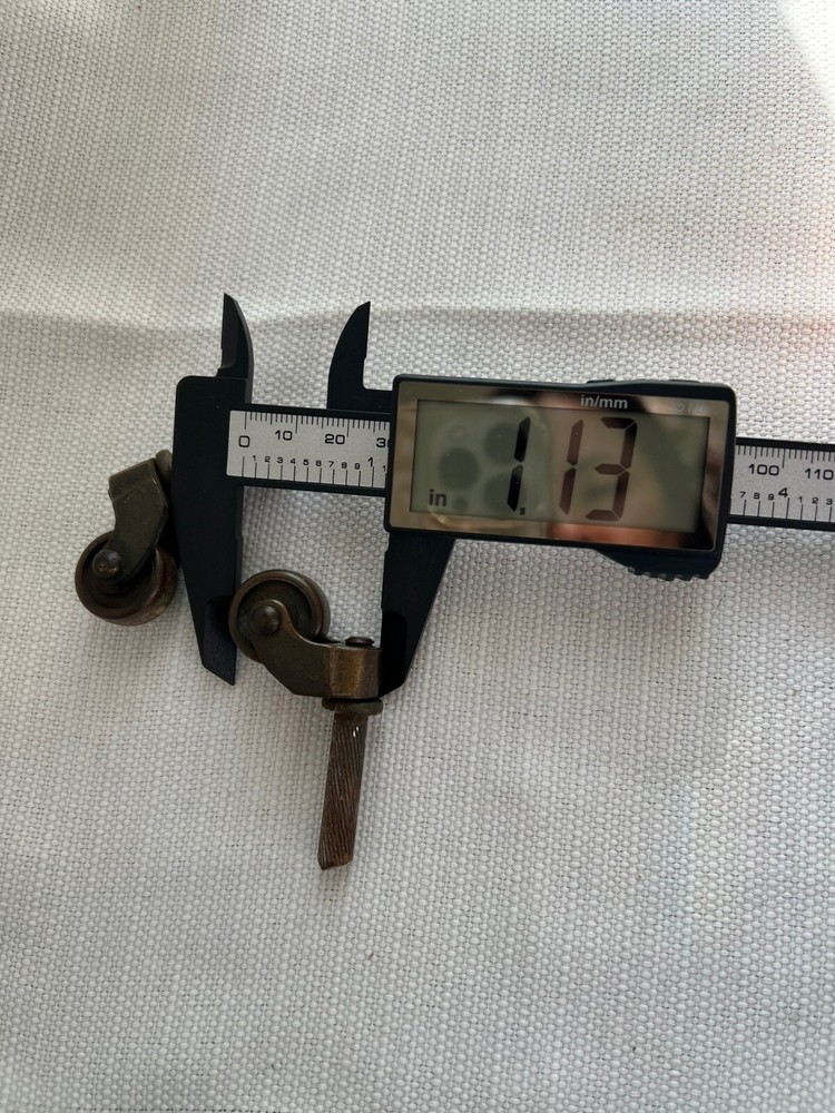 Two Antique Metal Casters