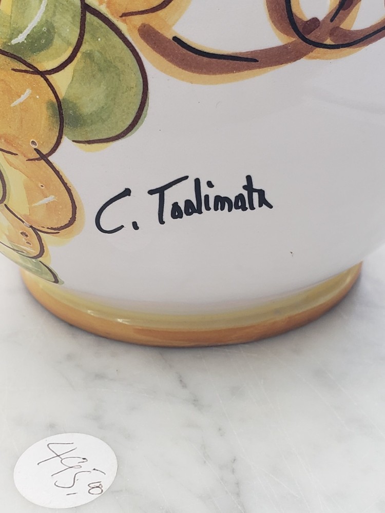 Hand painted, signed, ceramic pitcher,