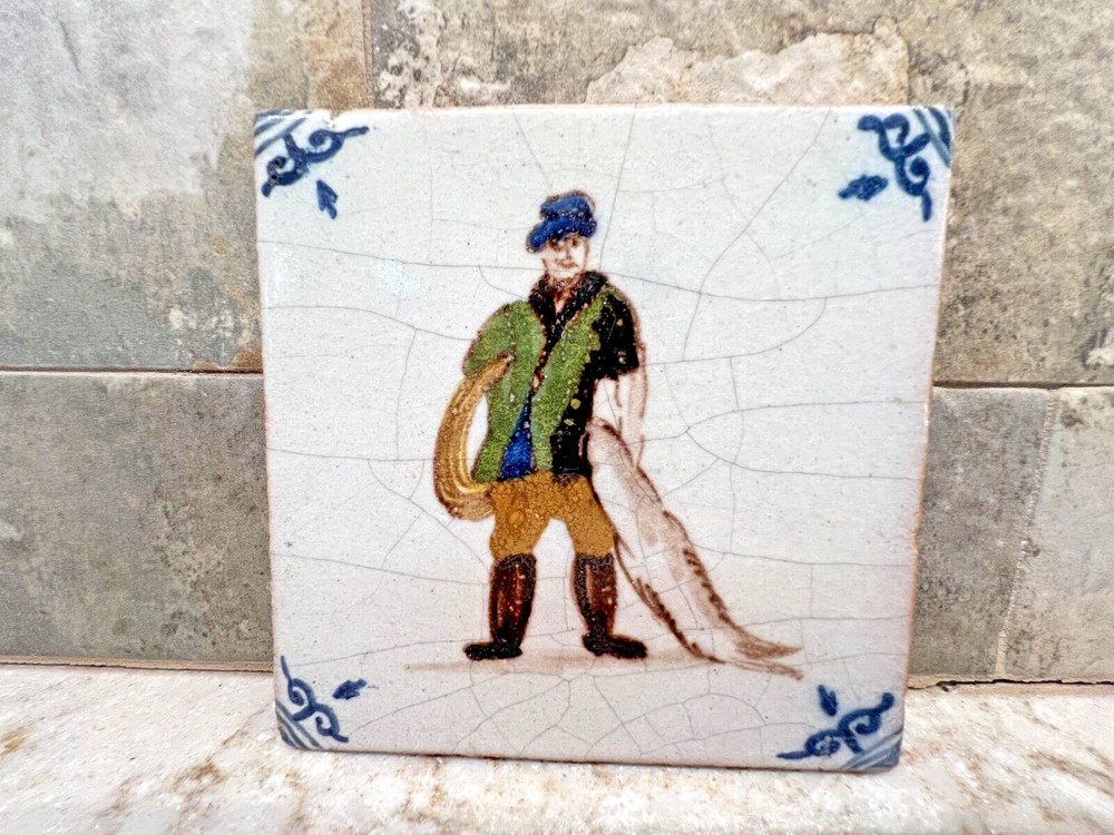 Hand Made Pottery Man With Fish Tile