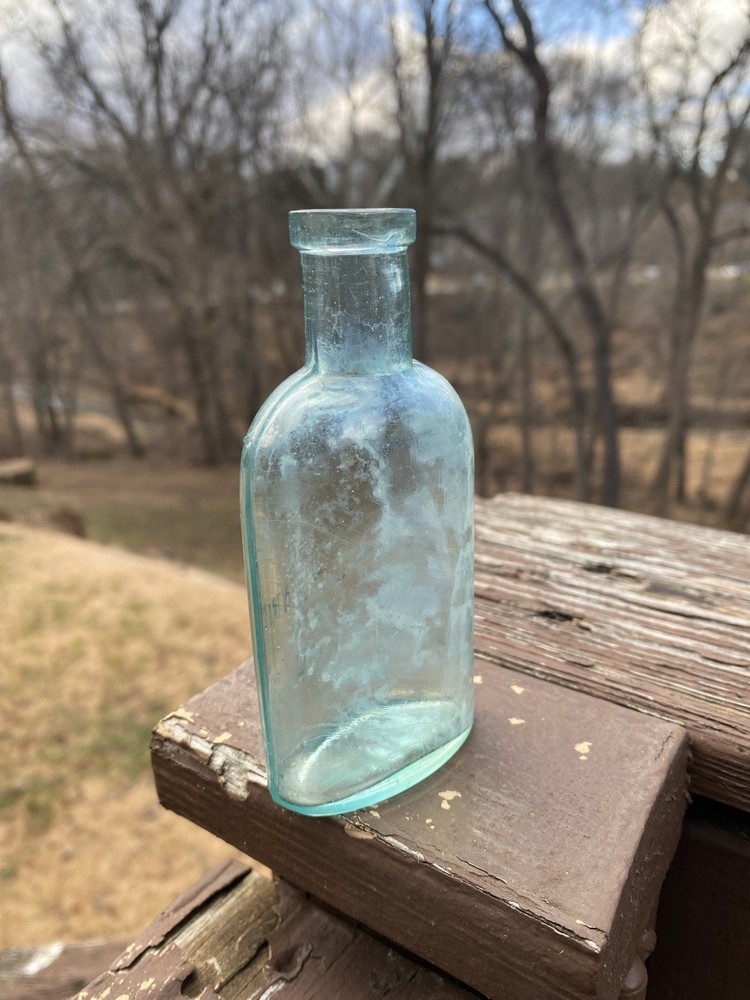 Week’s Snow Flake Blue Antique Bottle