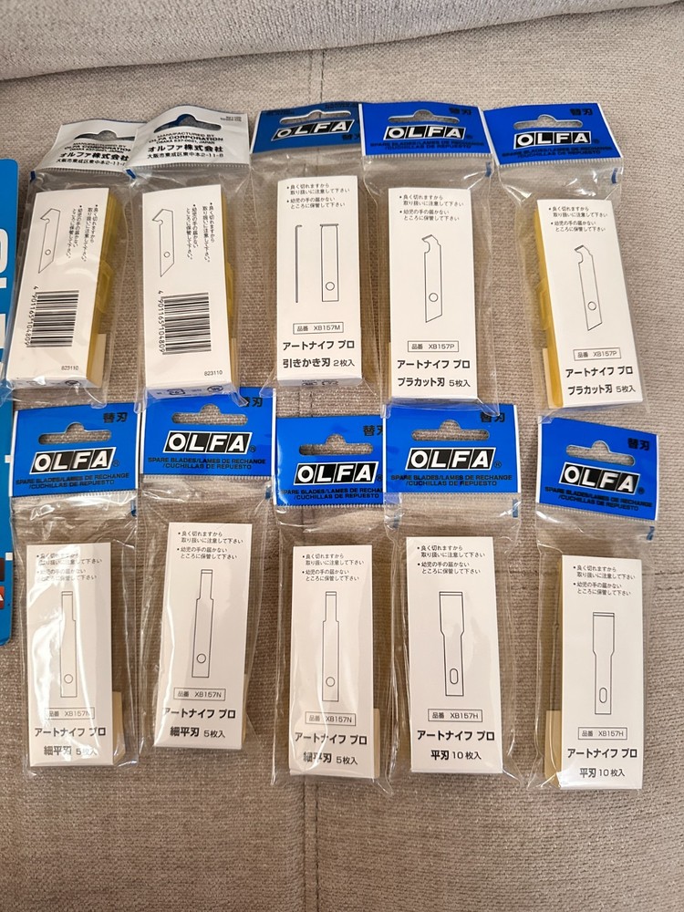 Three OLFA knives packs and 10 replacement blades