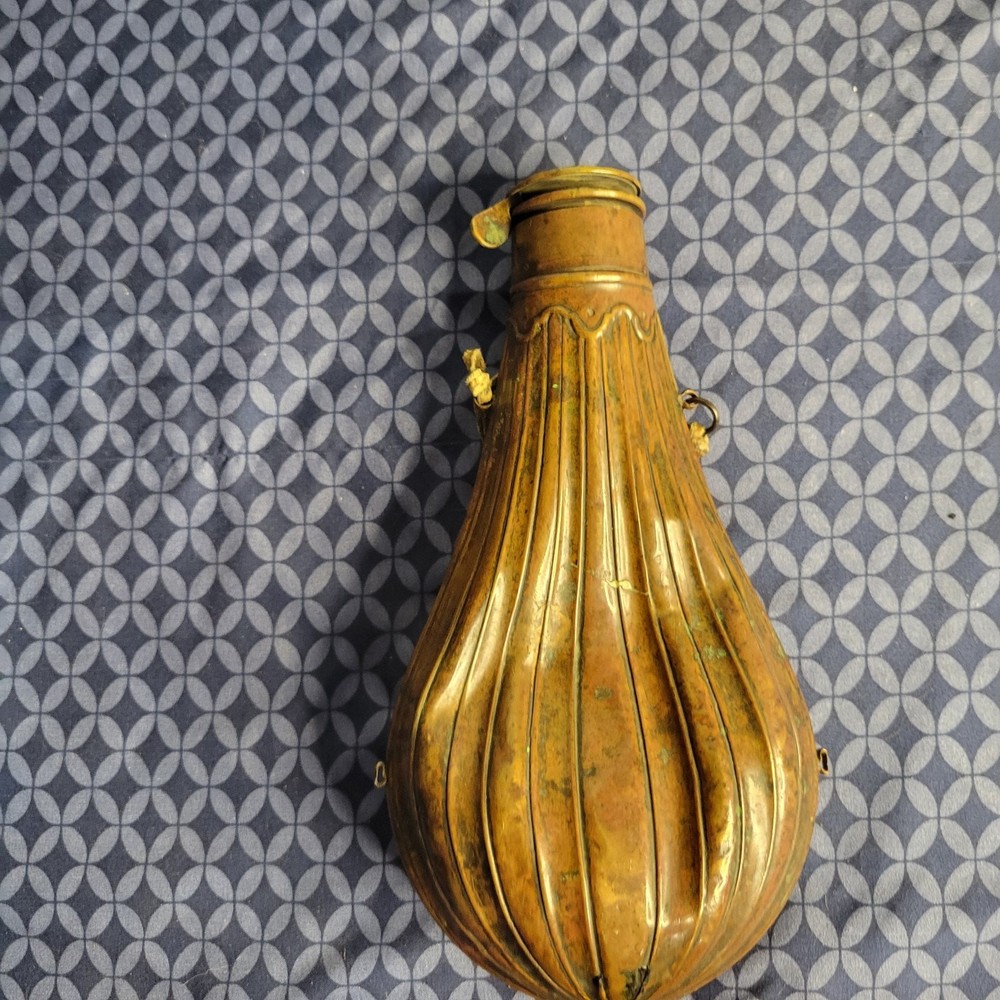1800's original powder flask large dent on front. tip may be missing.