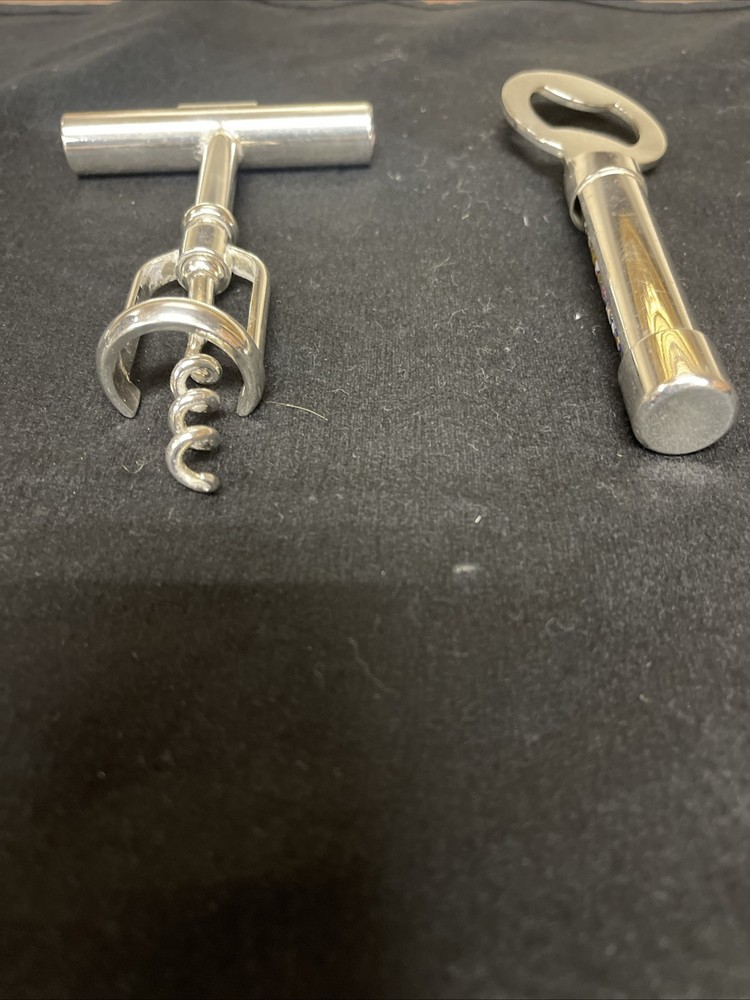 Silver corkscrew and bottle opener with blown glass insert