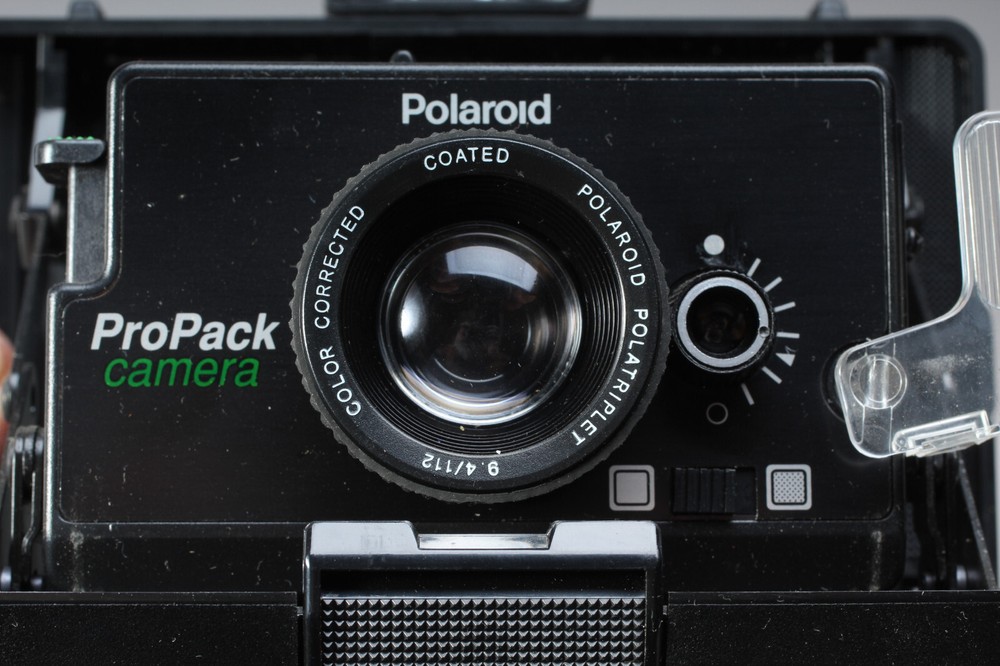 POLAROID PRO-PACK IN THE BOX W CAMERA FLASH STRAP & MANUALS FLASH BAD