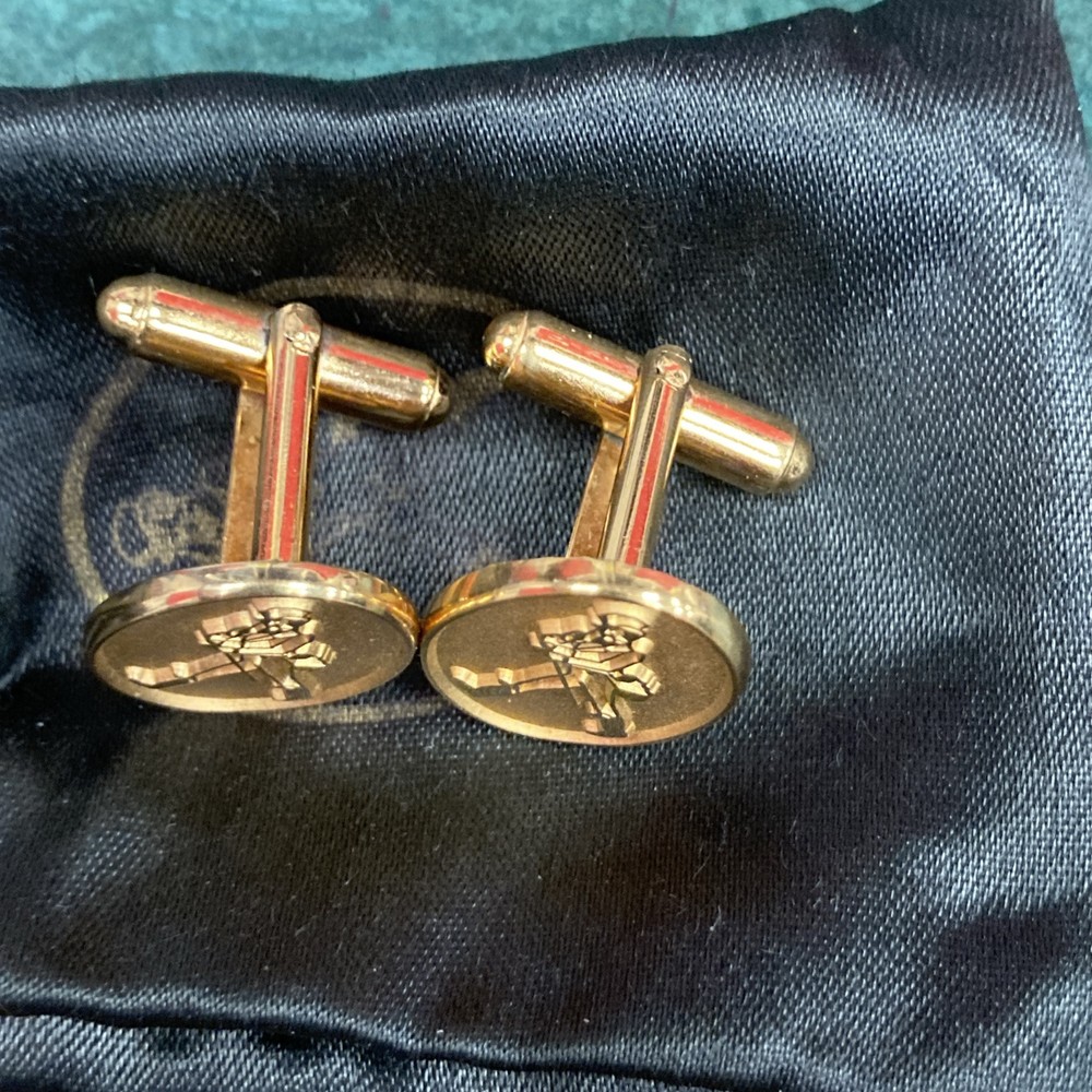 Gold tone cuff-links walking man