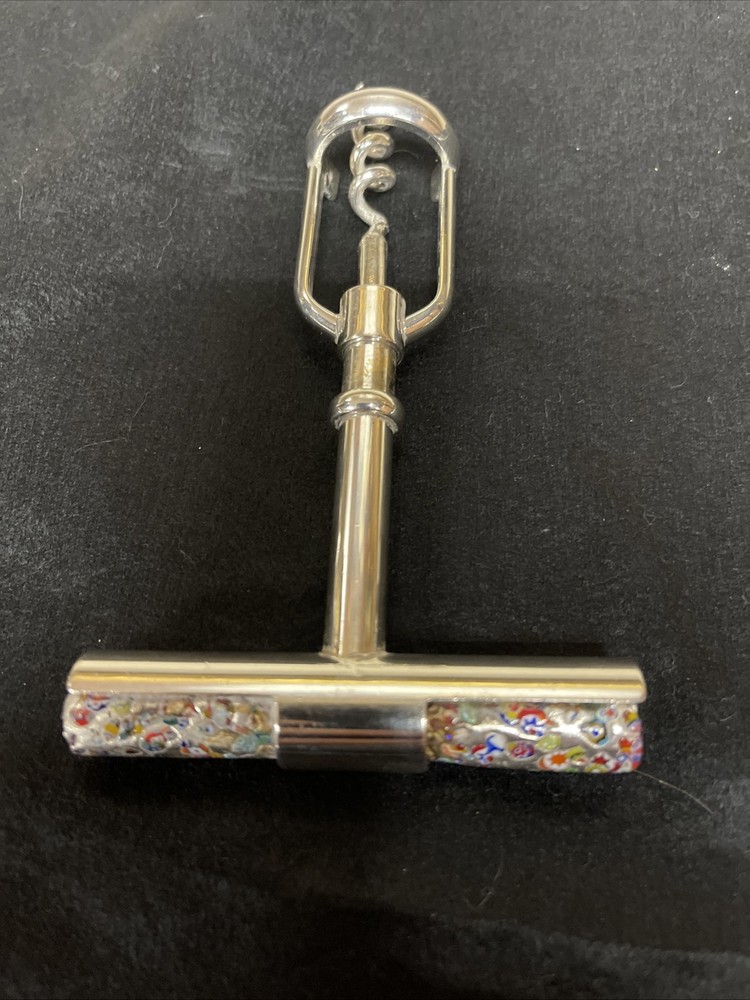 Silver corkscrew and bottle opener with blown glass insert