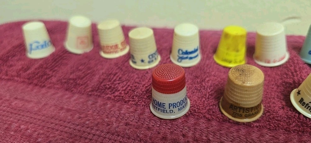 17 Plastic Thimbles 15 Have Advertising On Them