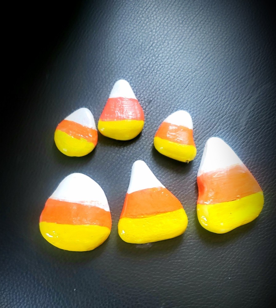 Hand Painted candy corn rocks. Kindness Rocks