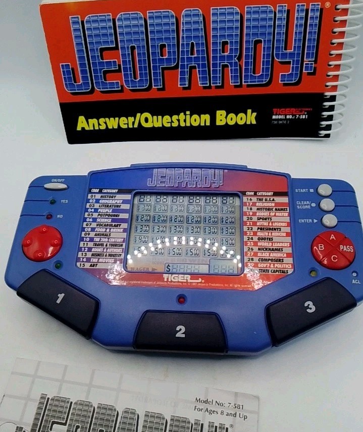 Tiger Electronics Jeopardy Hand Held Game 1995 with Answer Book & Manual