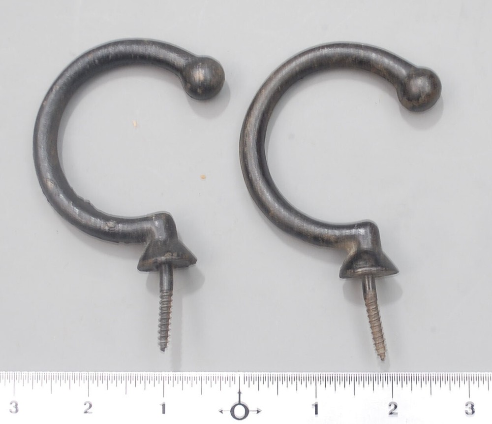Two enameled under-rail bridge hooks