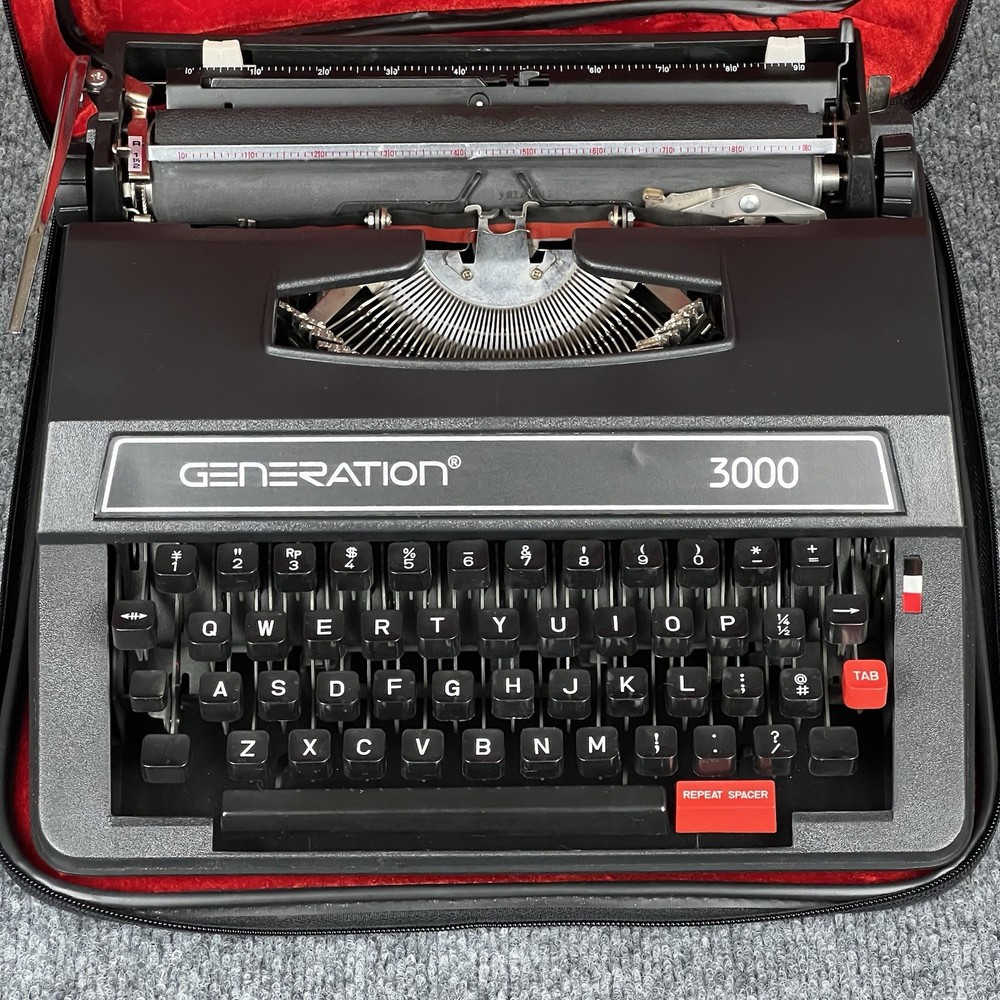 Generation 3000 Manual Typewriter with Case and Paperwork