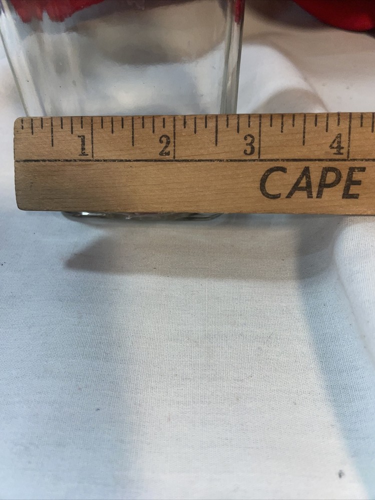 Clear bottle with latch lid- bottom has a b on it