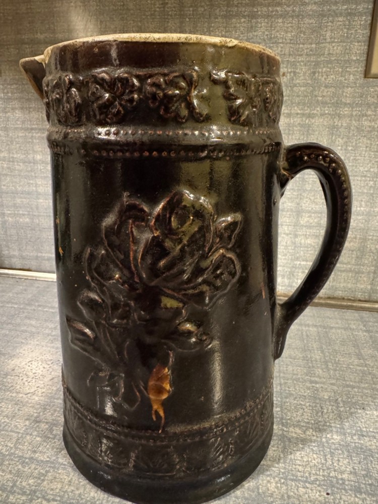 Antique Ceramic Pitcher with raised floral pattern