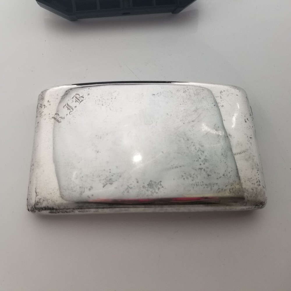 Vintage or antique sterling silver large curved cigarette case