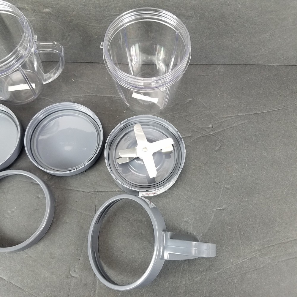 NutriBullet Mixed Lot Replacement Short Mixing Cups Handled Cup Lids Blade