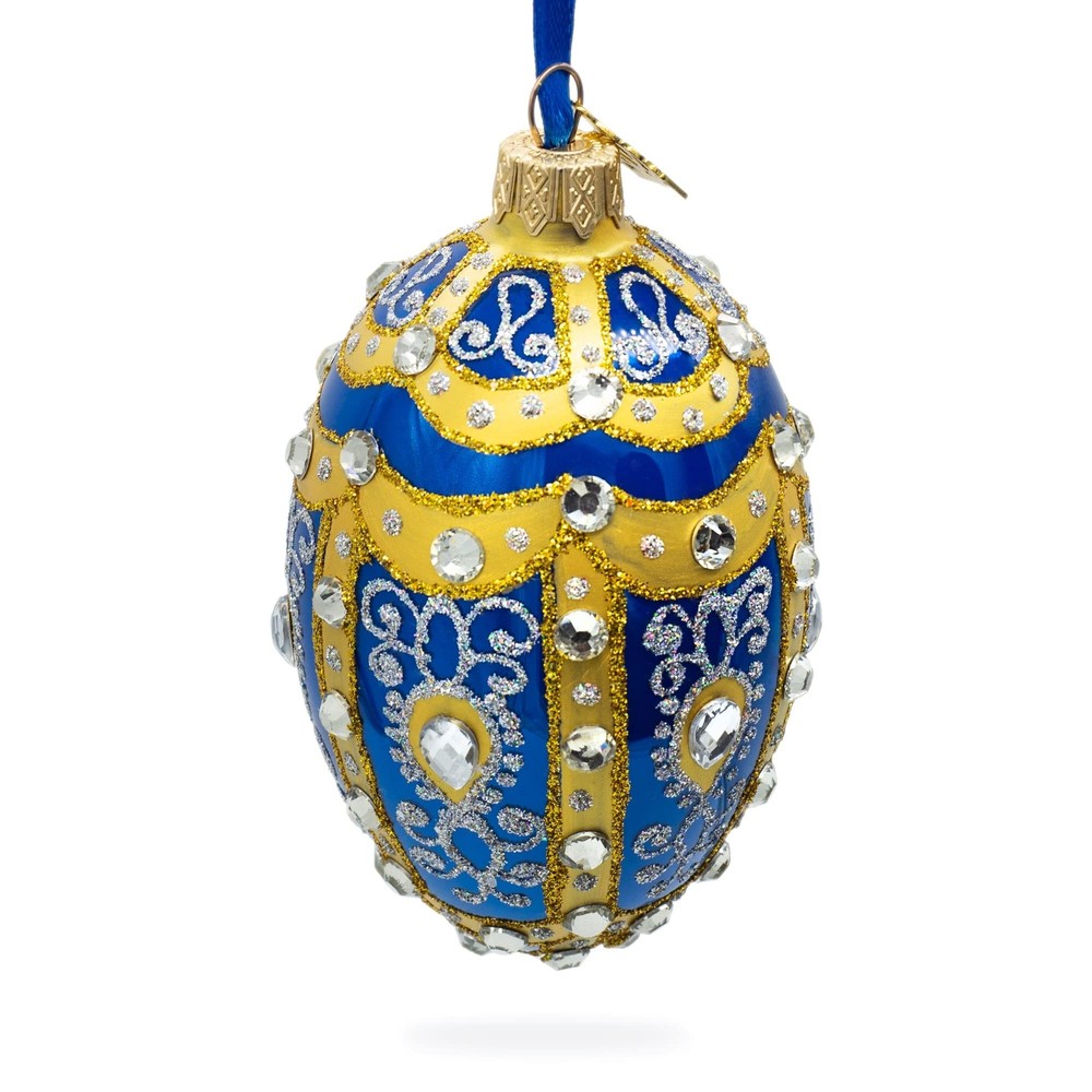 White Scrolls on Blue Glass Egg Ornament 4 Inches