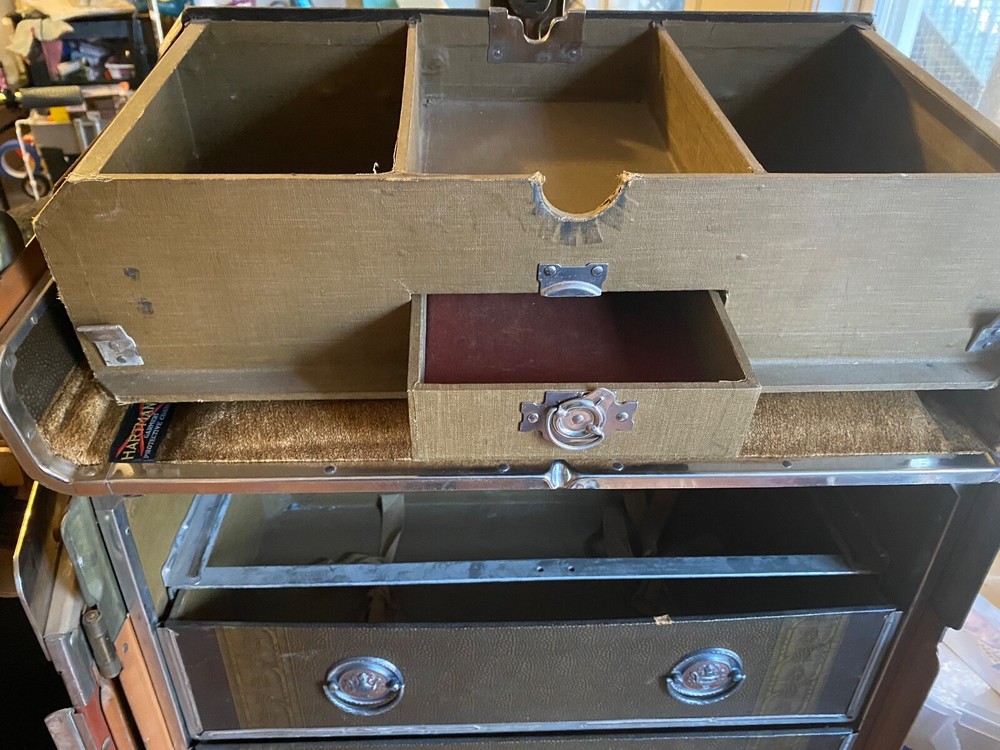 Immaculate early 1900 Hartman upright steamer trunk/cushion top.