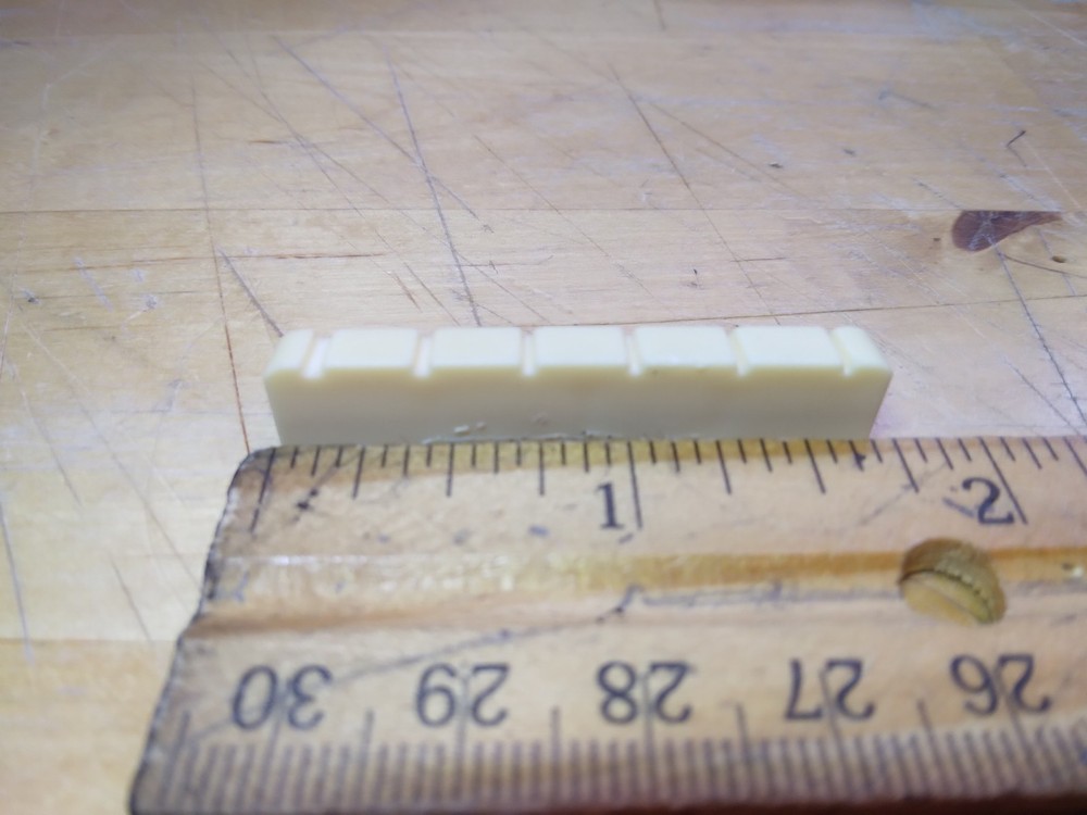 Vintage unbranded Plastic guitar Nut, white