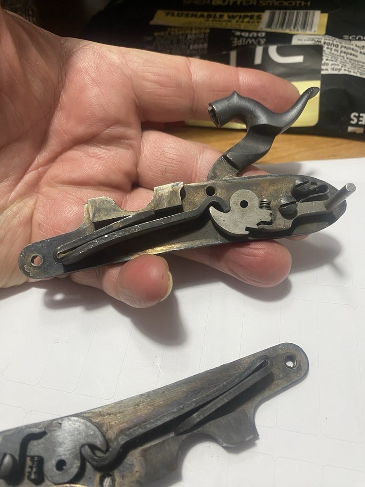 CVA Frointier Muzzleloader Lock and two screws.