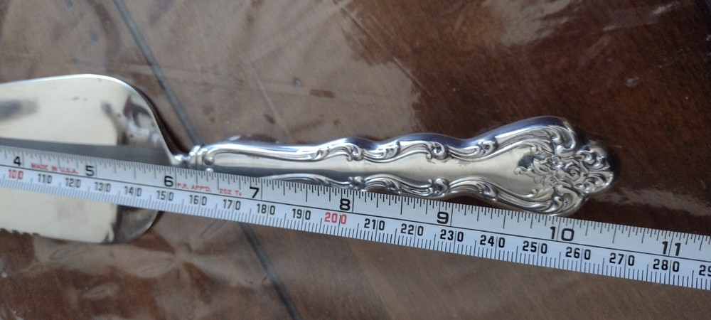 Pie/Cake Server Serrated Edge on one side with ornate design handle