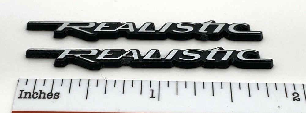 Realistic Minimus 7W Speaker Badge Custom Incised Laminated Plastic Pair Silver