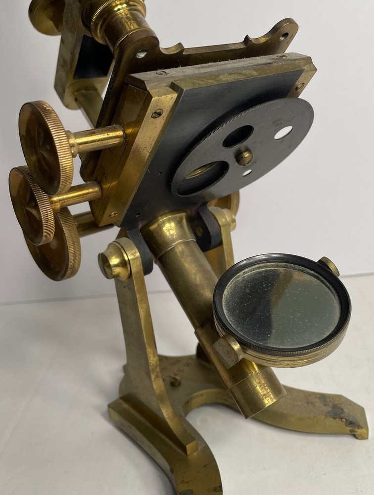 Antique Signed J.H. Steward microscope with case and some accessories.