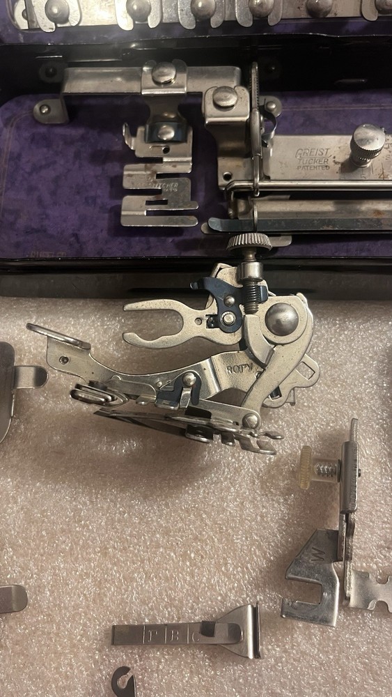 Vintage Greist Sewing Machine Attachments in “Rotary” Tin.