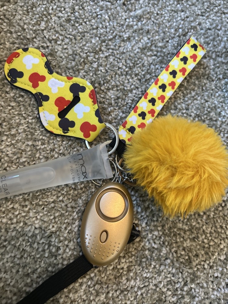 personal safety keychain set with several attached accessories.