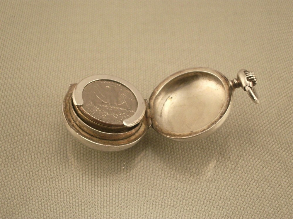 ANTIQUE SILVER COIN HOLDER