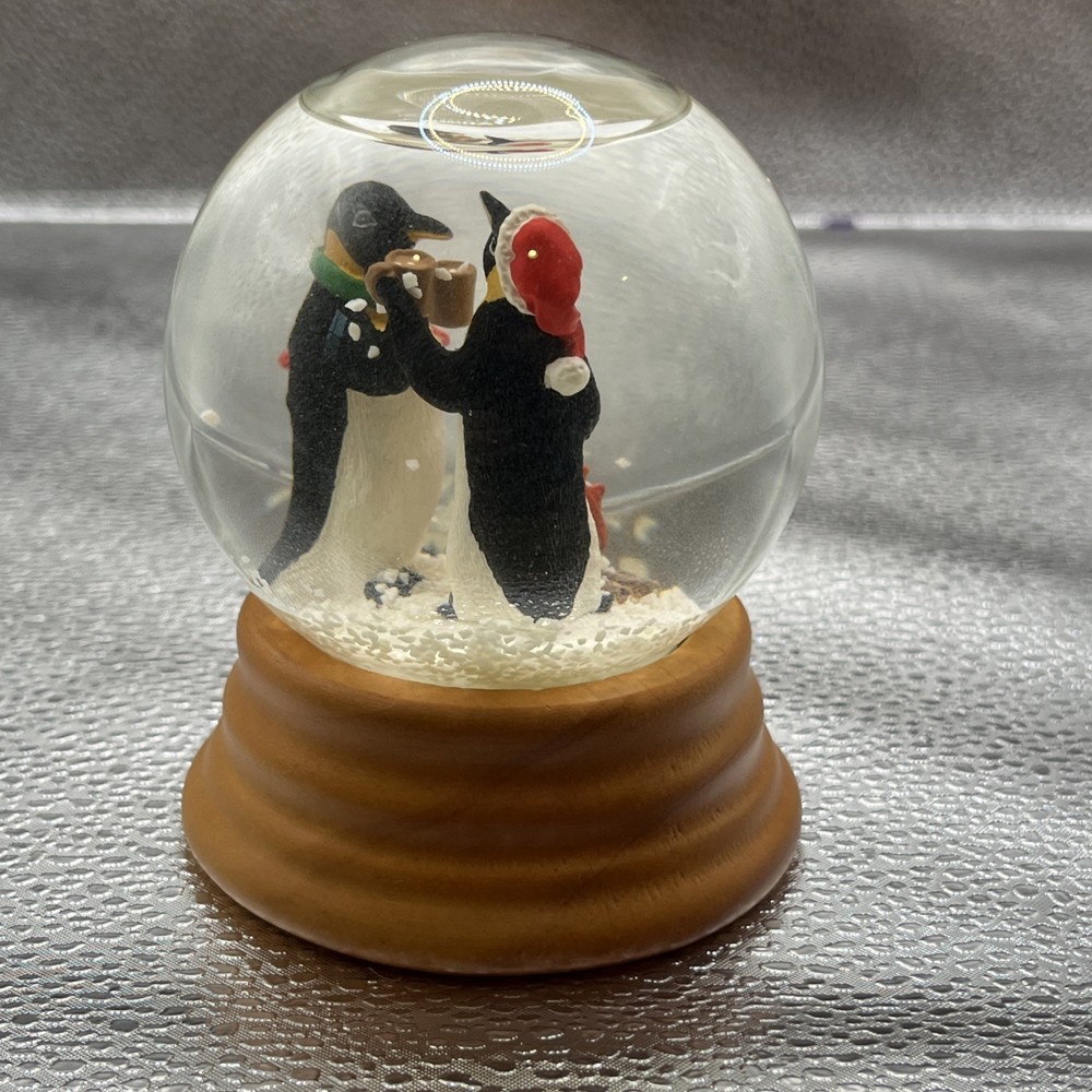 Eddie Bauer Penguin Snow globe 2002 Open Fire Roasting Marshmallows