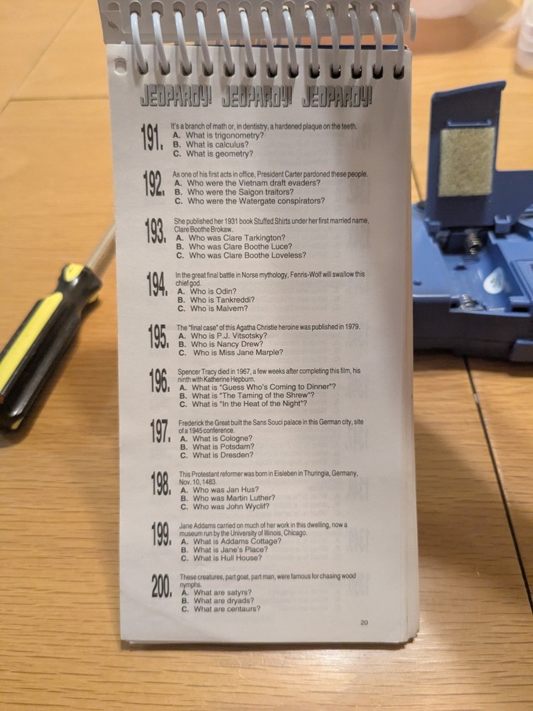 Tiger Electronics Jeopardy Hand Held Game 1995 with Answer Question Book