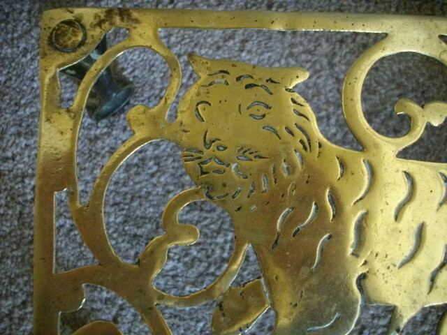 Brass trivet stand with strolling Tiger c1880