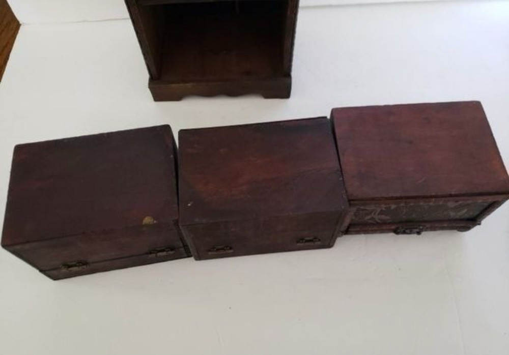 3 Small Storage Trunks in Shelving Unit