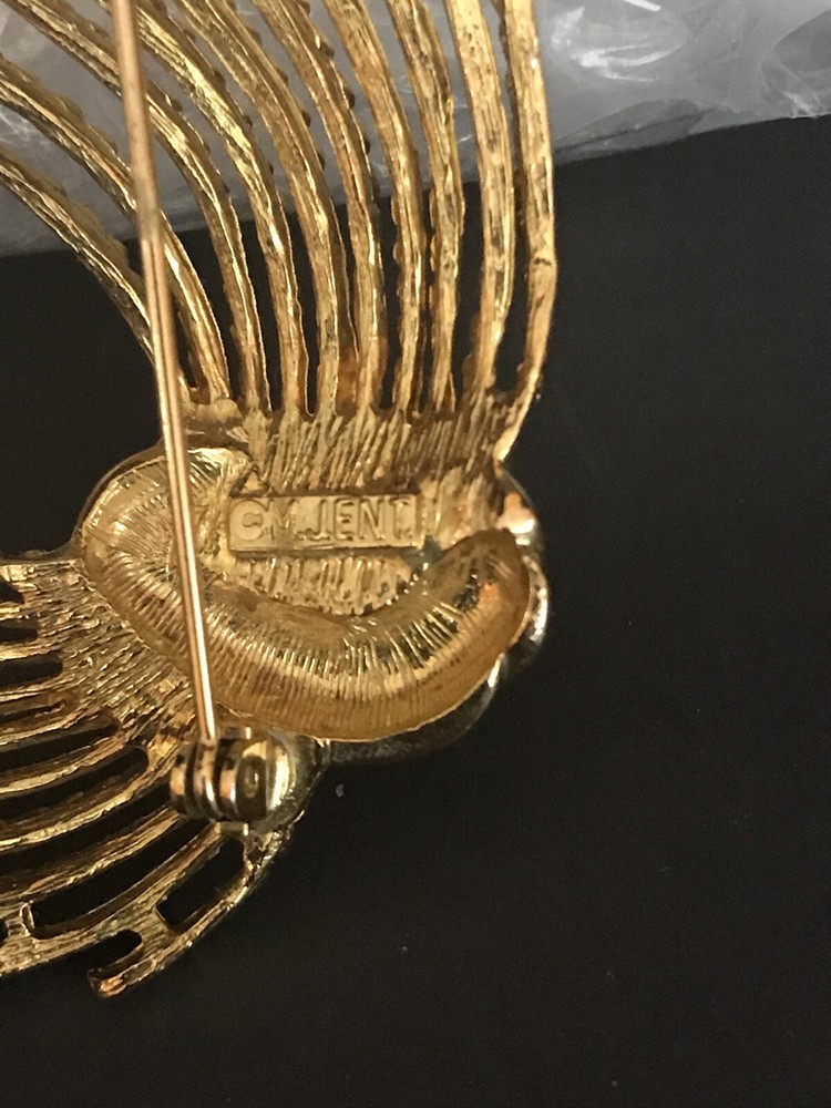 m jent brooch Sign
